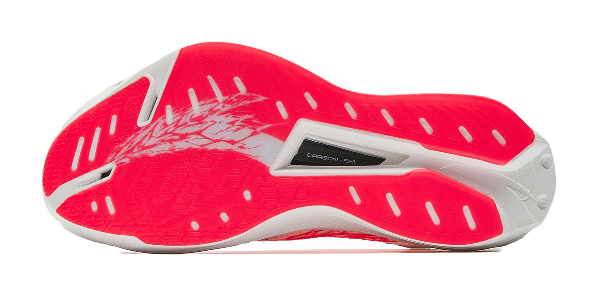 Anta women’s running shoe outsole in red and white with textured traction pattern