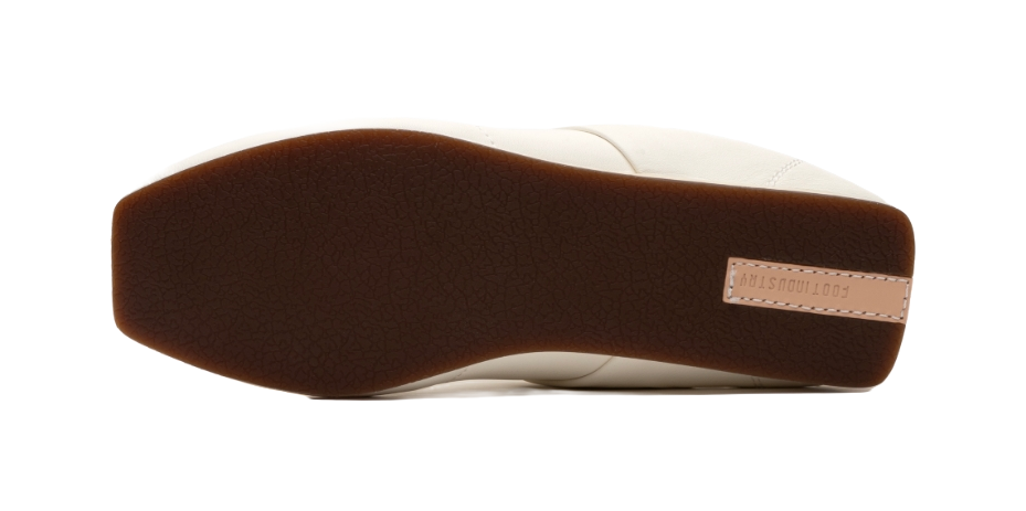 Thin-soled trainer outsole, dark brown underside with minimal grip tread