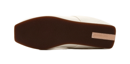 Thin-soled trainer outsole, dark brown underside with minimal grip tread