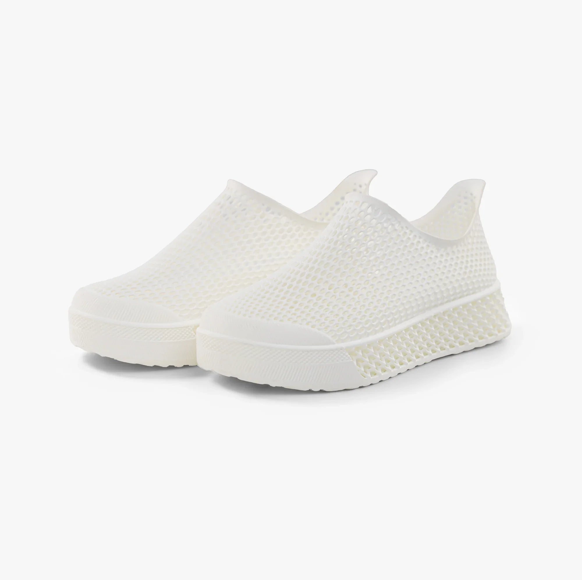 Pair of off-white slip-on sneakers with 3D printed mesh and cushioned sole