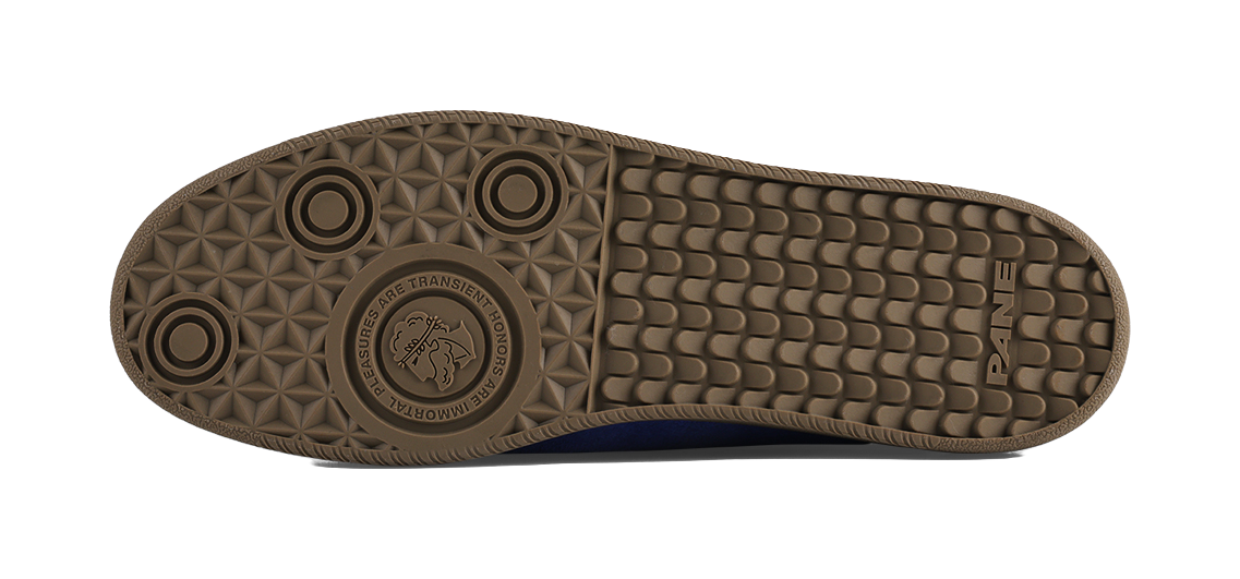 Brown outsole tread pattern with circular grip and traction texture.