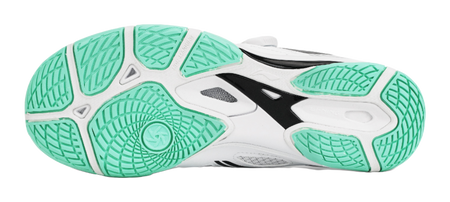 Table tennis shoe outsole in mint green with textured traction pattern over white base