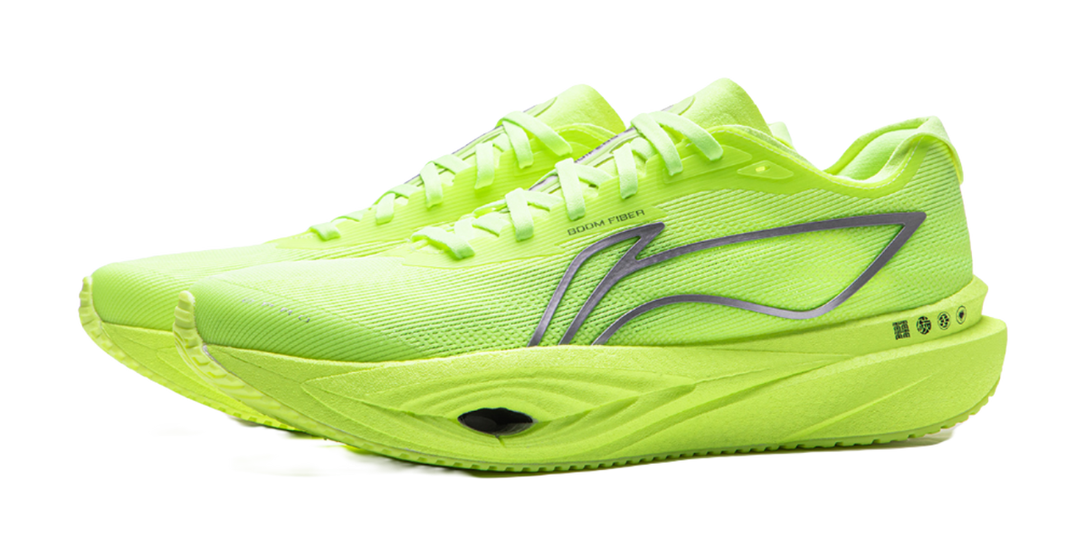 Neon yellow green low-top running shoes, front 3/4 view, lace-up, rocker sole