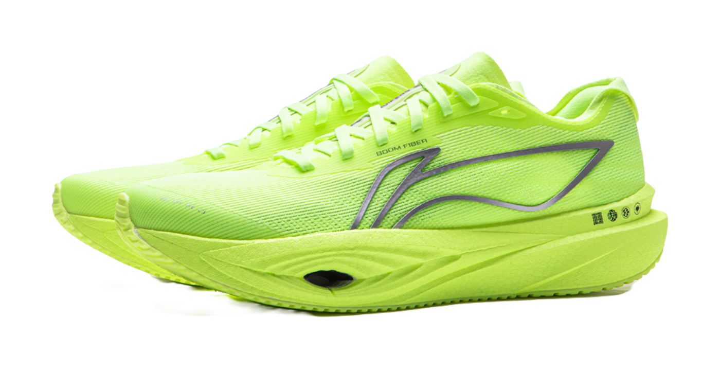 Neon yellow green low-top running shoes, front 3/4 view, lace-up, rocker sole