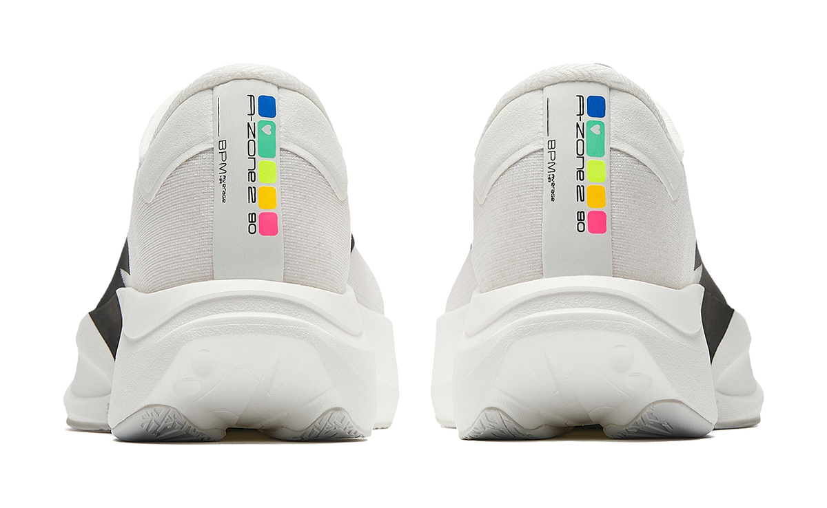 White running shoes with multicolor heel text and thick cushioned heel counter