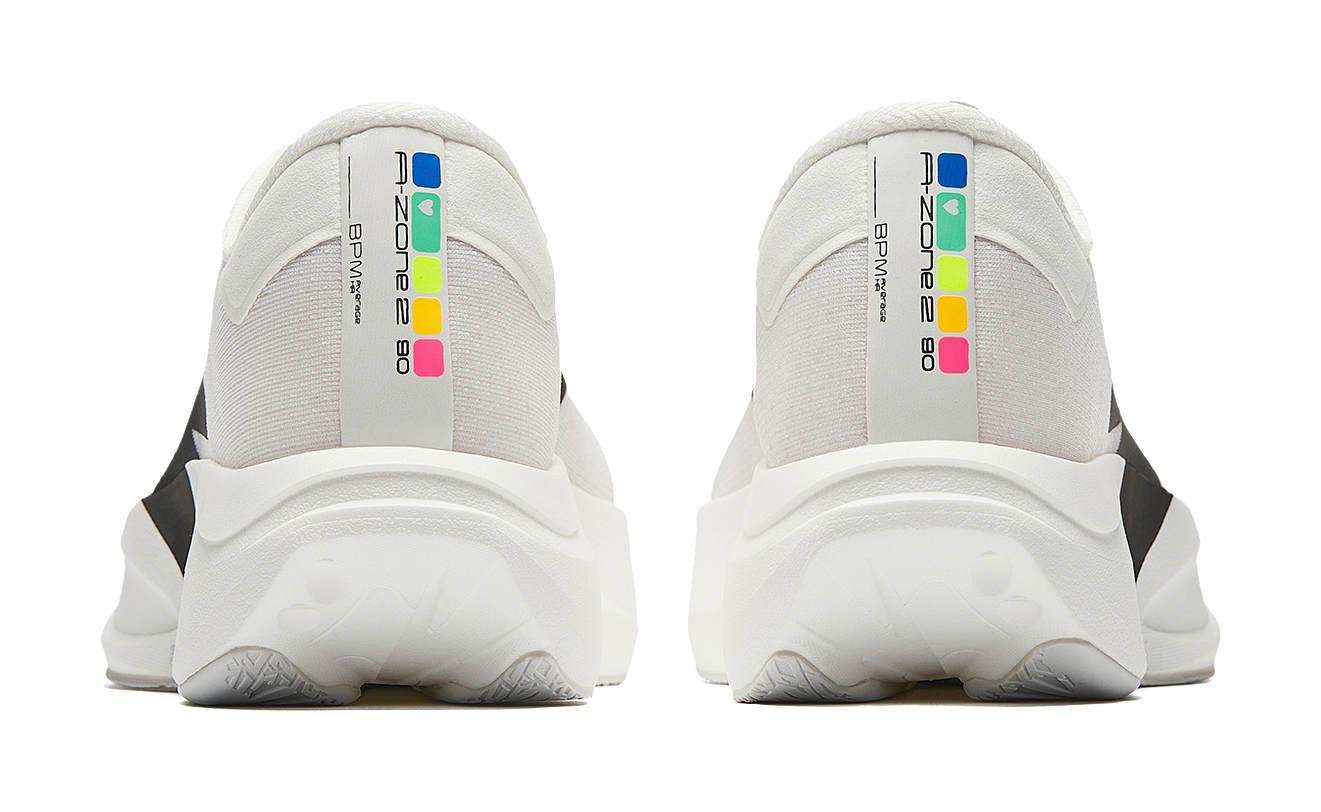 White running shoes with multicolor heel text and thick cushioned heel counter
