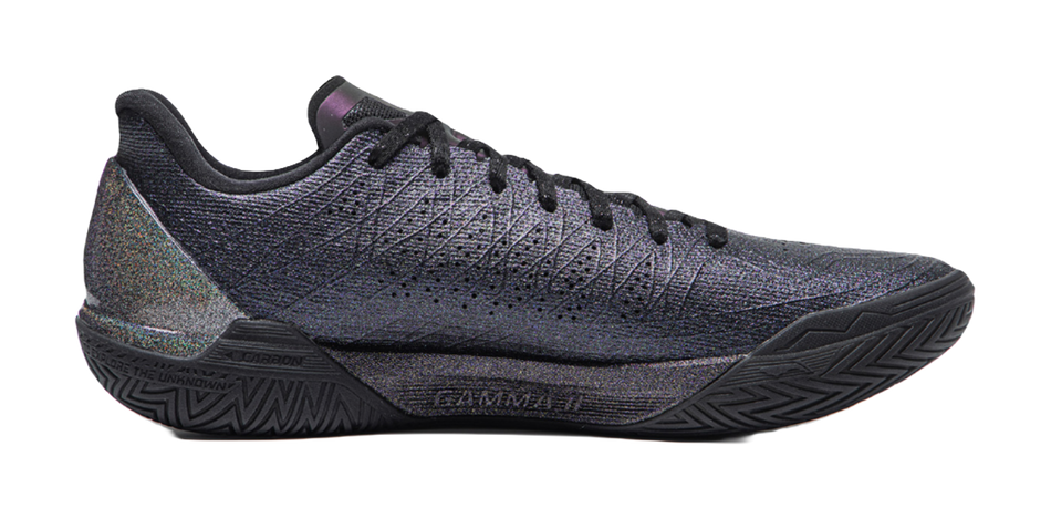 Low-top basketball shoe with textured knit upper and lace-up front; dark blue with green detail