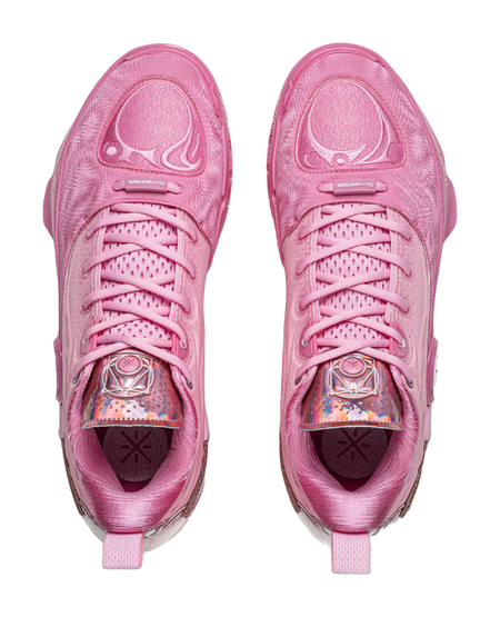 Pink lace-up basketball sneakers pair with padded tongue and textured upper