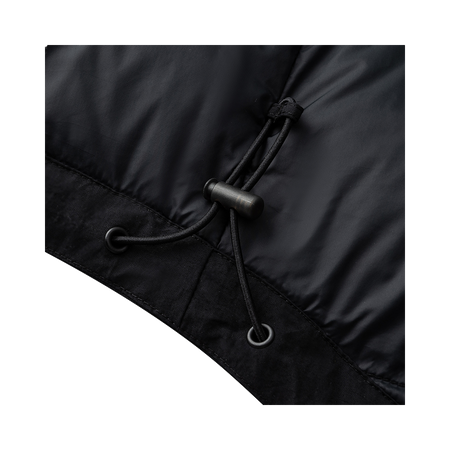 Black jacket drawstring with metal toggles and eyelets at hem.