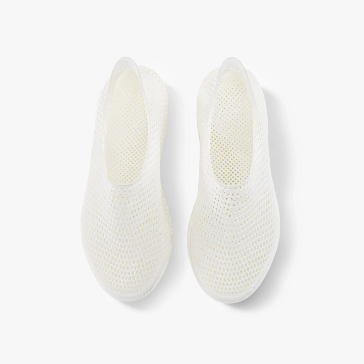 Off-white slip-on sneakers, rear view showing textured mesh footbed and heel