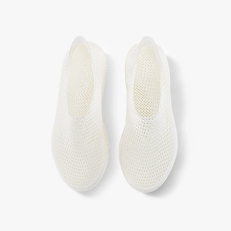 Off-white slip-on sneakers, rear view showing textured mesh footbed and heel