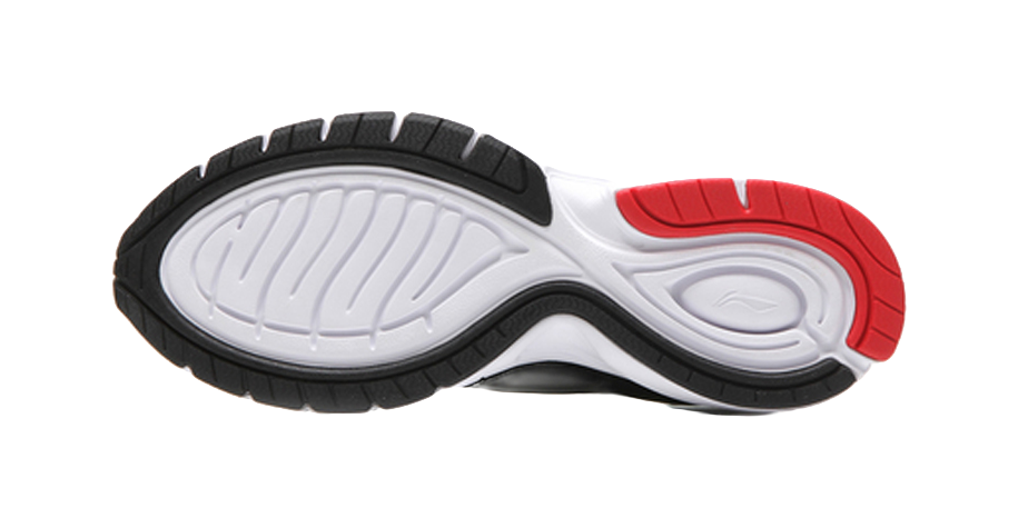 Lightweight running shoe outsole, black tread with white midfoot section and red heel