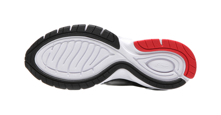 Lightweight running shoe outsole, black tread with white midfoot section and red heel
