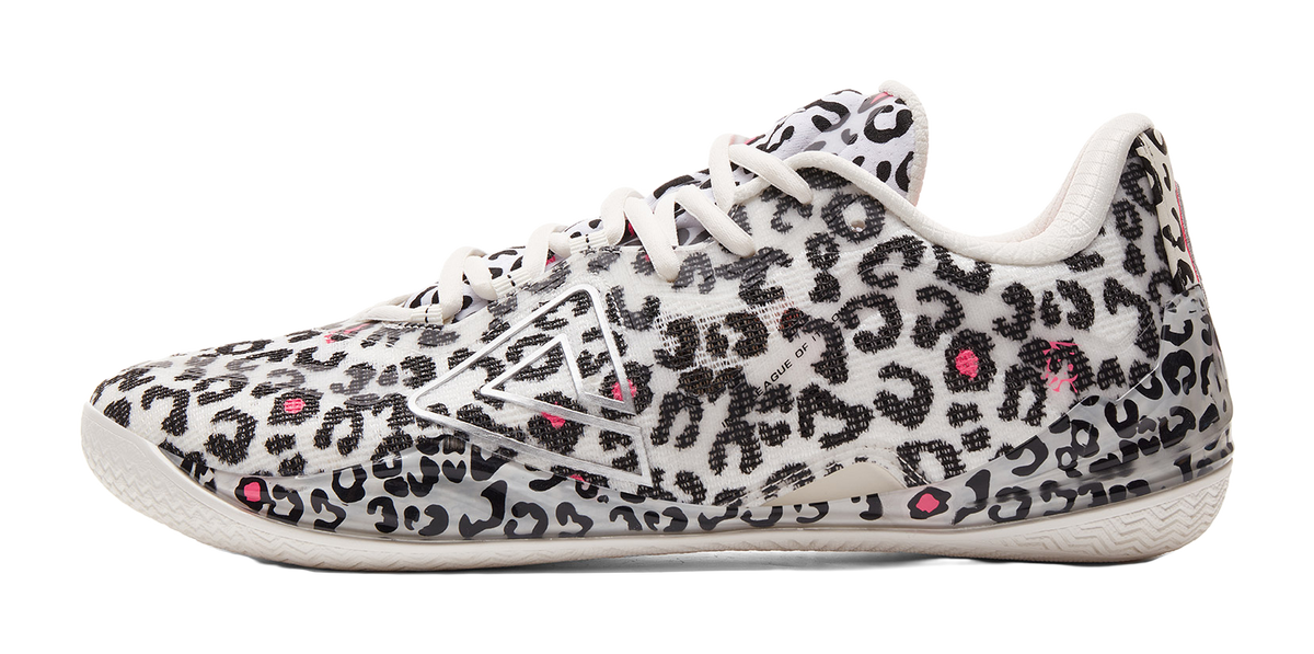 White low-top basketball shoe with black leopard pattern, pink triangle logo, and laces