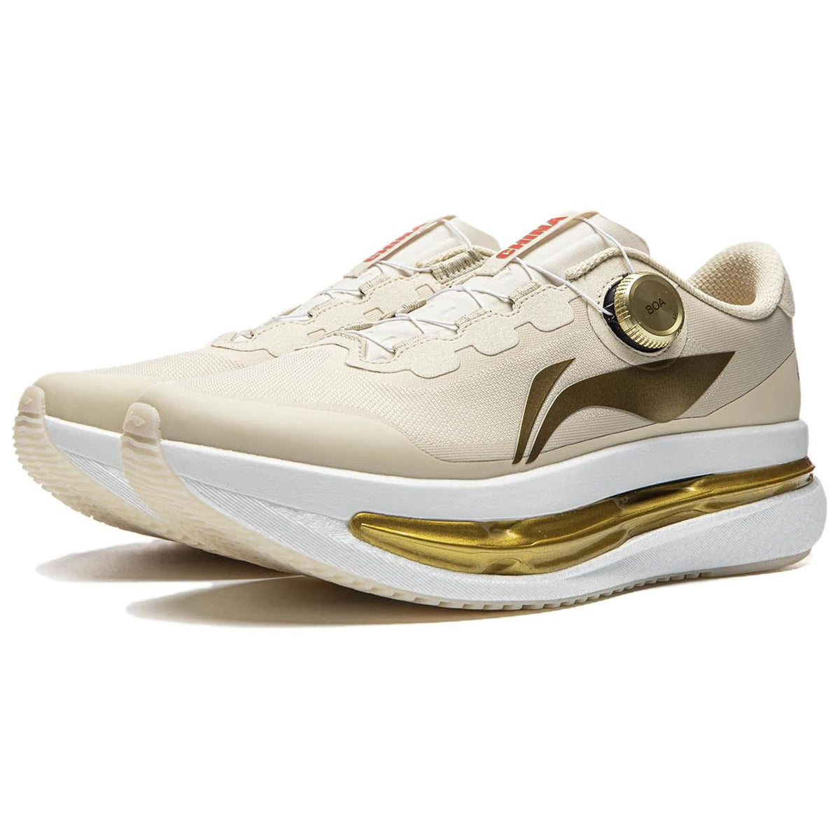 Khaki running shoe with BOA dial and gold midsole plate, angled side view