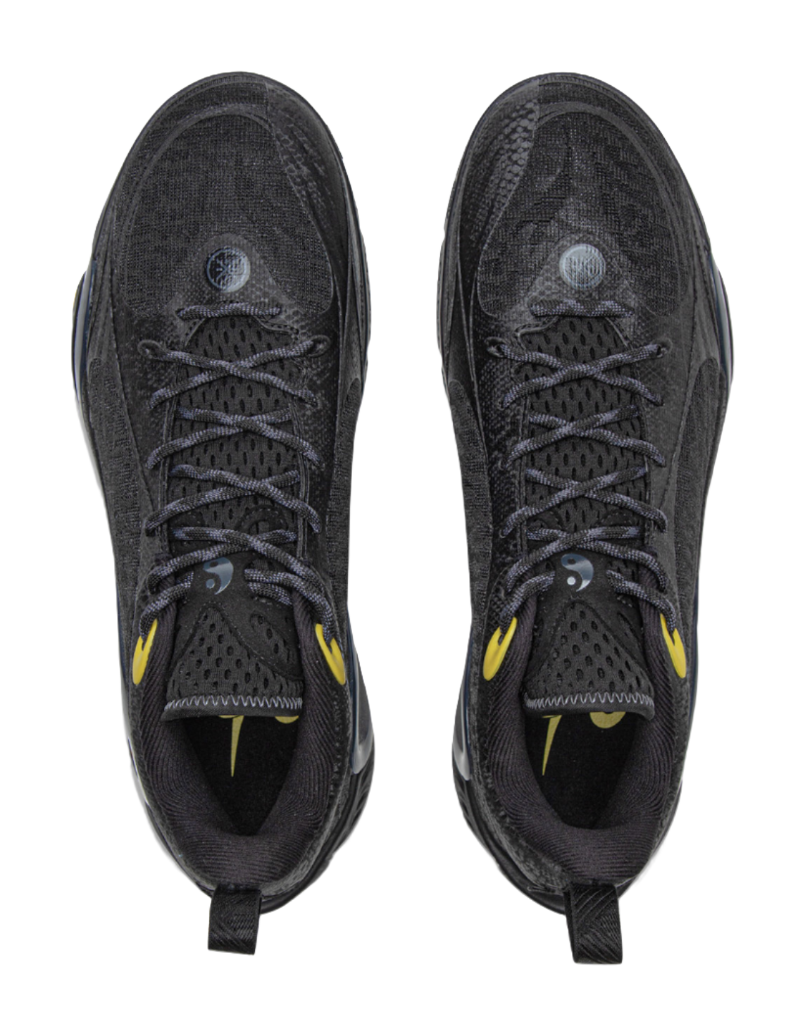Black basketball shoes with lace-up fronts and breathable textured uppers