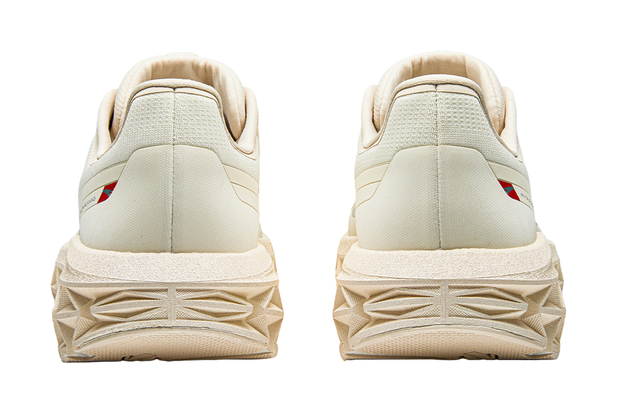 Women’s Anta running shoes rear view, padded heel and chunky textured tread outsole.