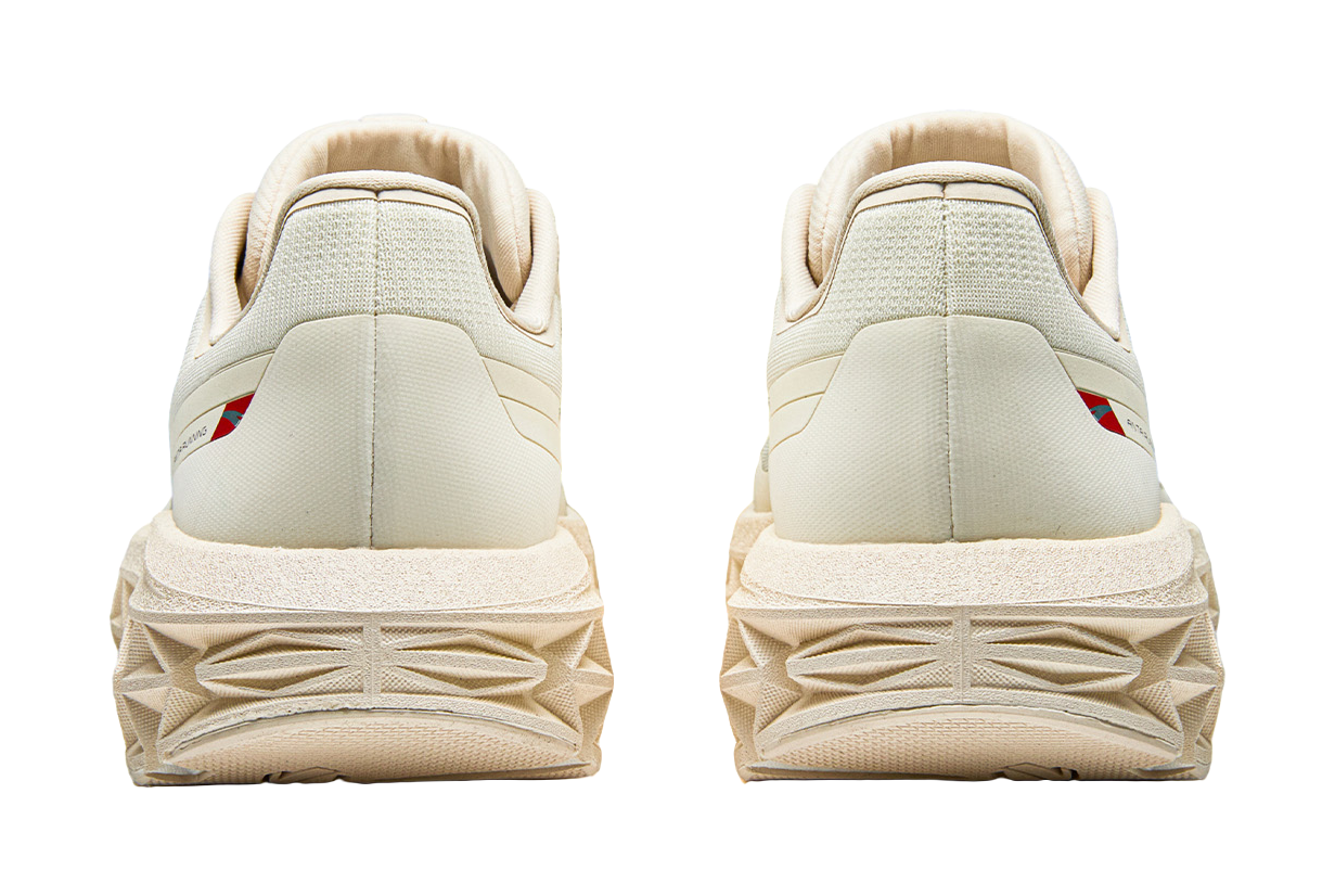 Women’s Anta running shoes rear view, padded heel and chunky textured tread outsole.