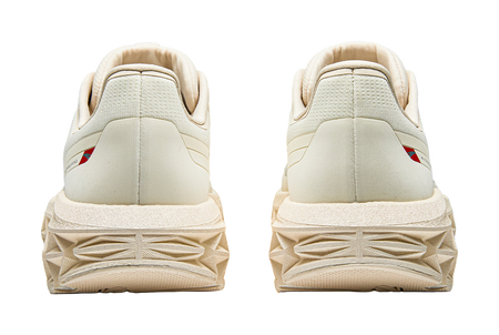 Women’s Anta running shoes rear view, padded heel and chunky textured tread outsole.