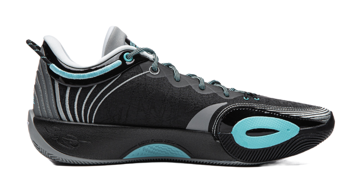 Black basketball shoe angled side view with teal logo and zebra-like trim