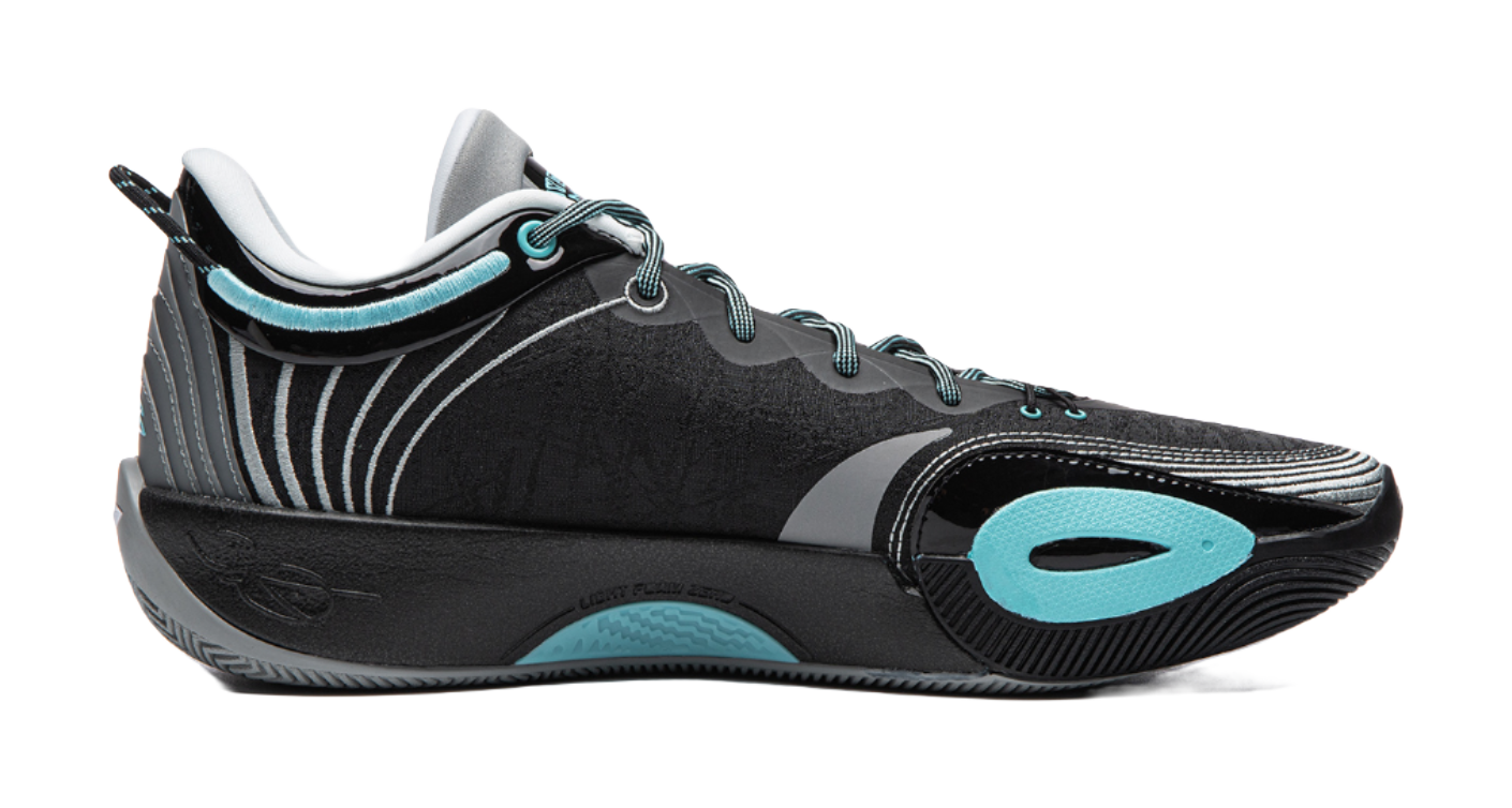 Black basketball shoe angled side view with teal logo and zebra-like trim