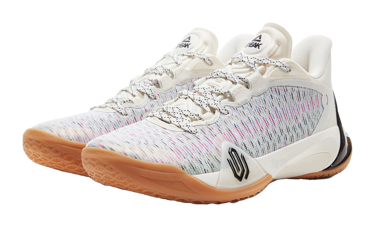 White basketball shoe with multicolor knit upper, black accents, gum outsole