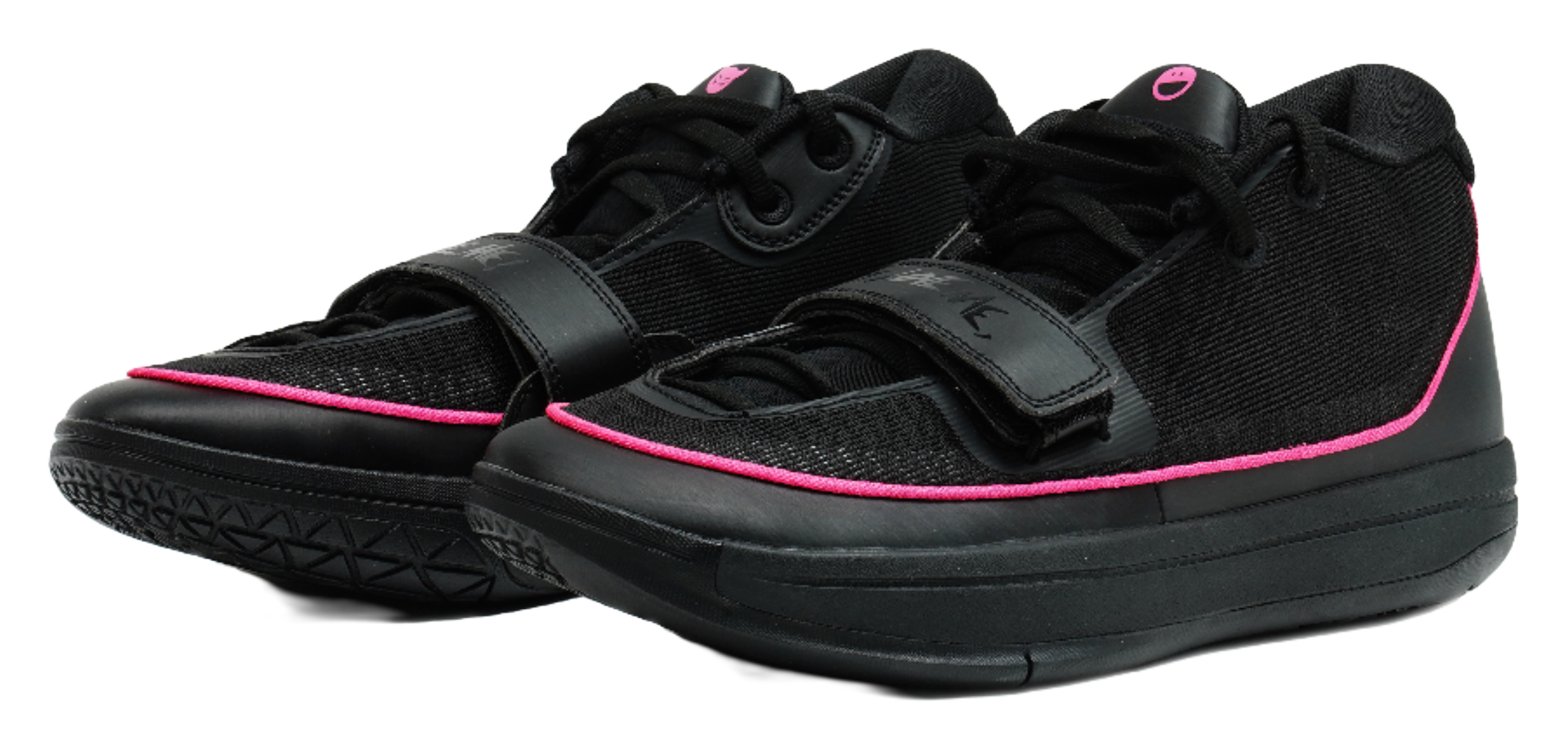 Pair of black basketball shoes with pink piping, lace-up, and padded ankle