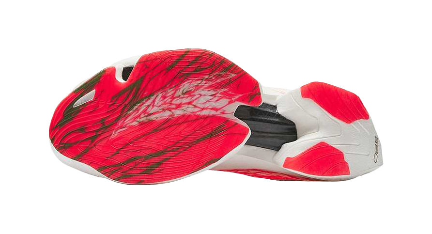 Women’s low-top running shoe outsole side view, white base with red panel accents