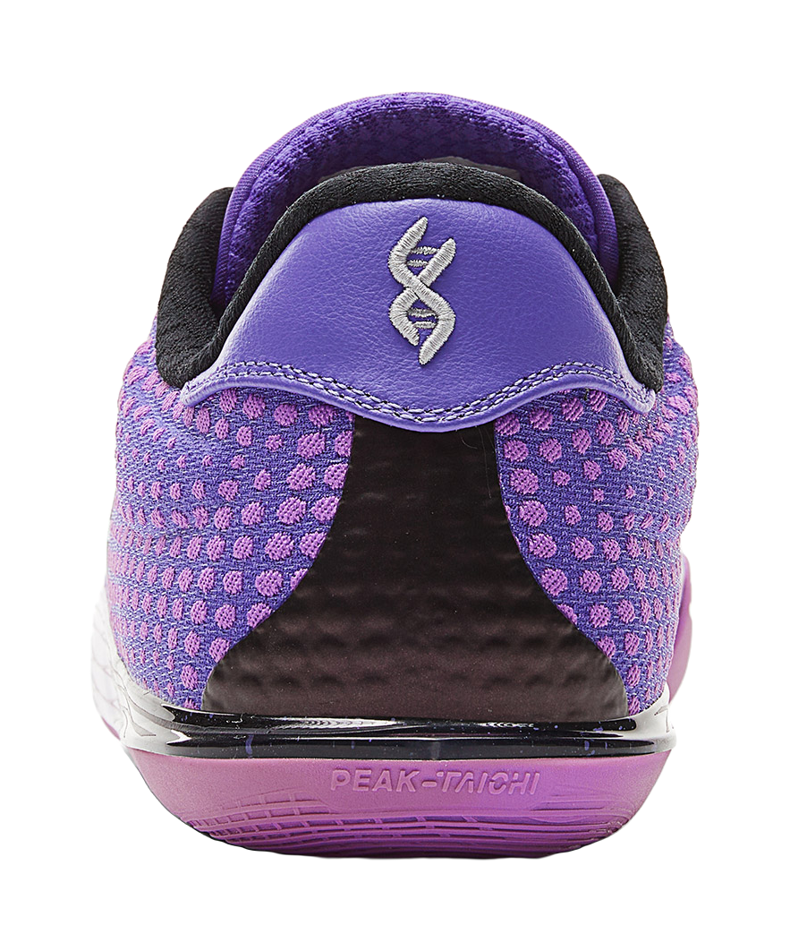 Back of crystal purple basketball shoe with black heel collar and small logo on tab