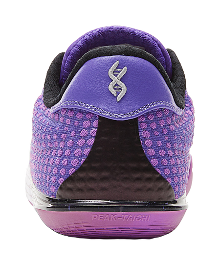Back of crystal purple basketball shoe with black heel collar and small logo on tab