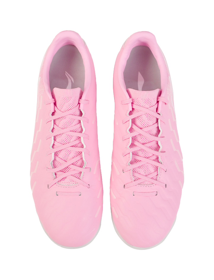 Pair of unisex turf soccer shoes, pinkish mesh uppers, lace closure, TPU studs