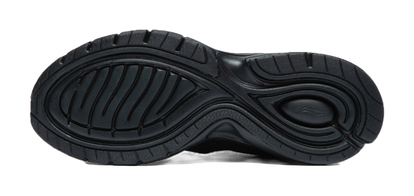 Black rubber outsole with tread pattern and cushioning ridges under running shoe.