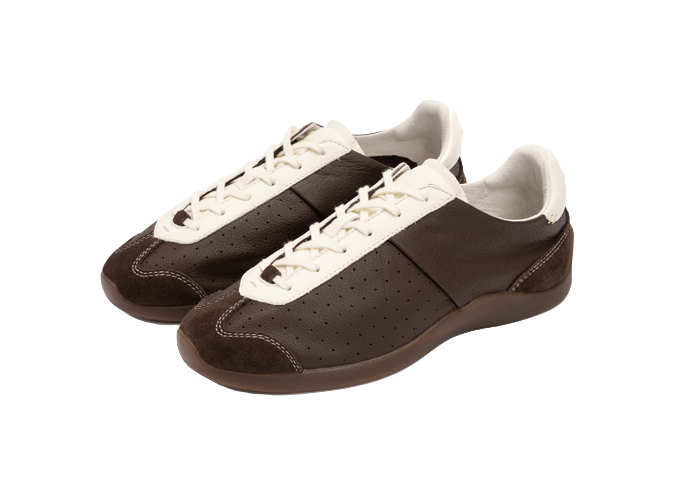 Two brown low-top sneakers with antique white laces and perforated side panels.