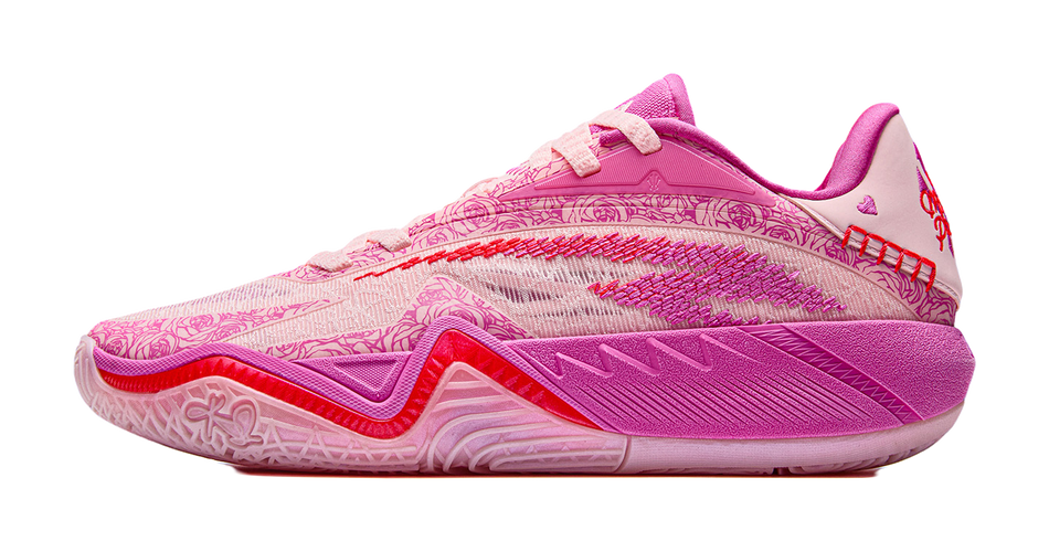 Pink lace-up basketball shoe with textured patterned upper and thick sole