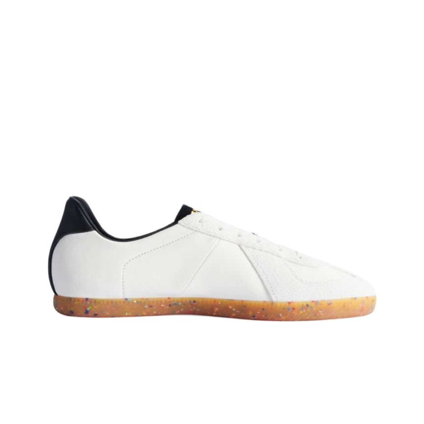 White low-top training sneakers with dark heel tab and speckled gum rubber sole