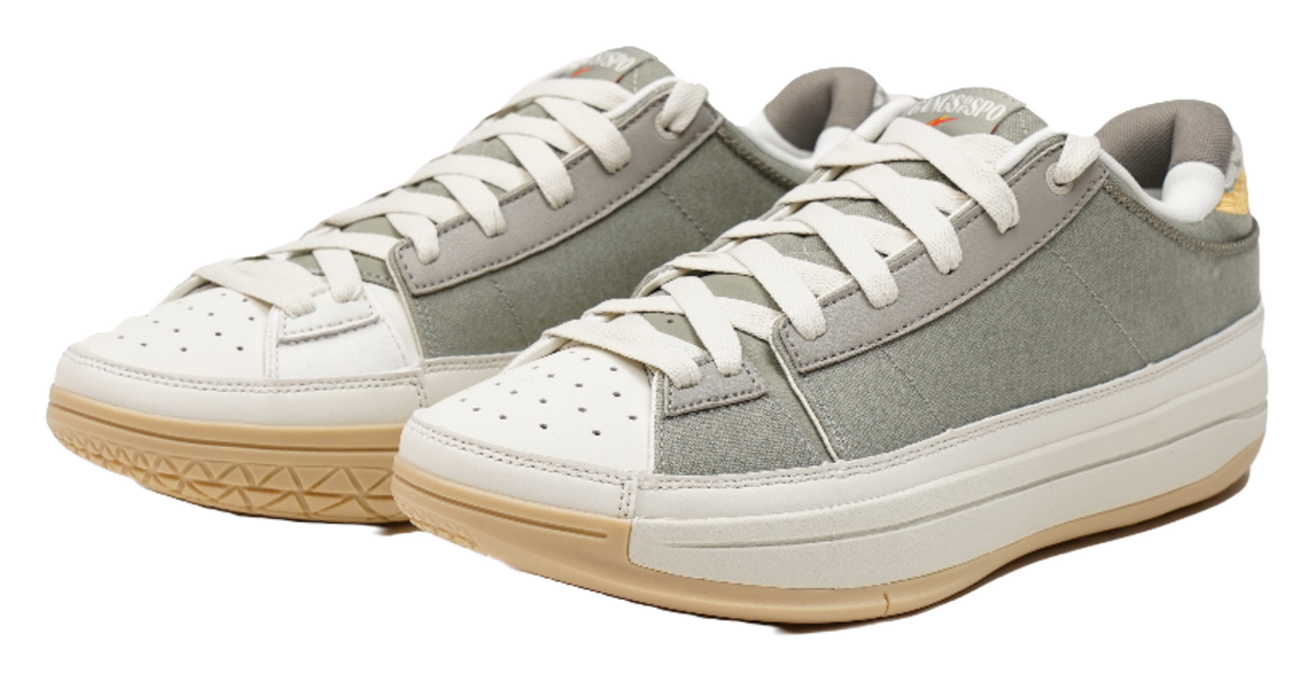 Pair of unisex basketball shoes, olive upper with white laces and gum outsole