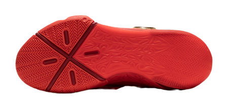 Red basketball shoe outsole with traction tread pattern.
