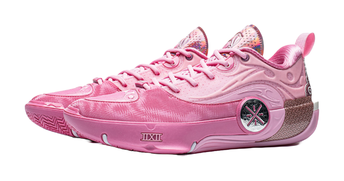 Pink basketball sneaker, front side view with circular emblem and lace-up