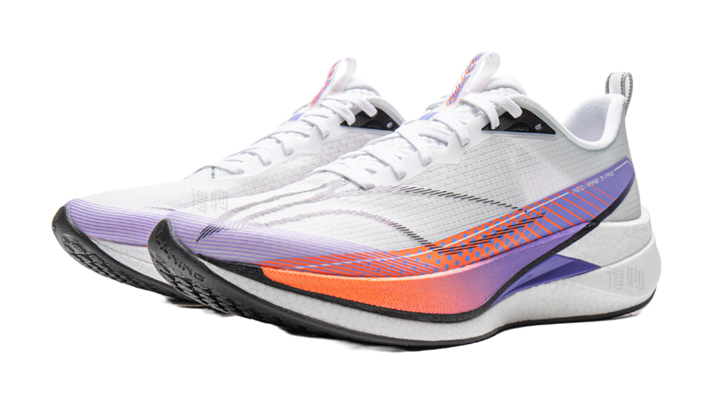 Pair of white running shoes with purple overlays and orange-blue wave graphics