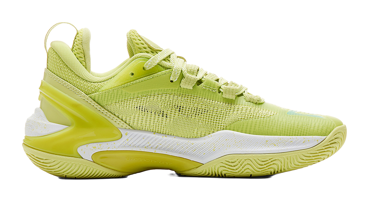 Light acid green basketball shoe side view with lace-up, white midsole and wing logo