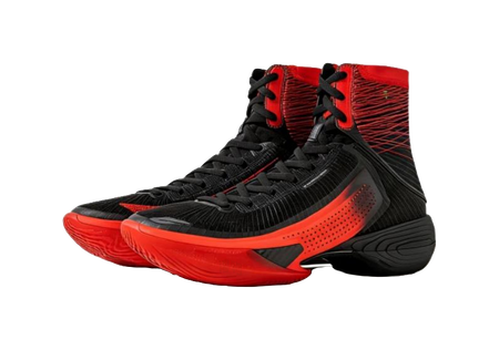 Black high-top basketball shoe with red laces, perforated panel, and black rubber outsole