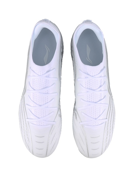 White silvery soccer cleat pair, rear view with lace-up uppers and studs.
