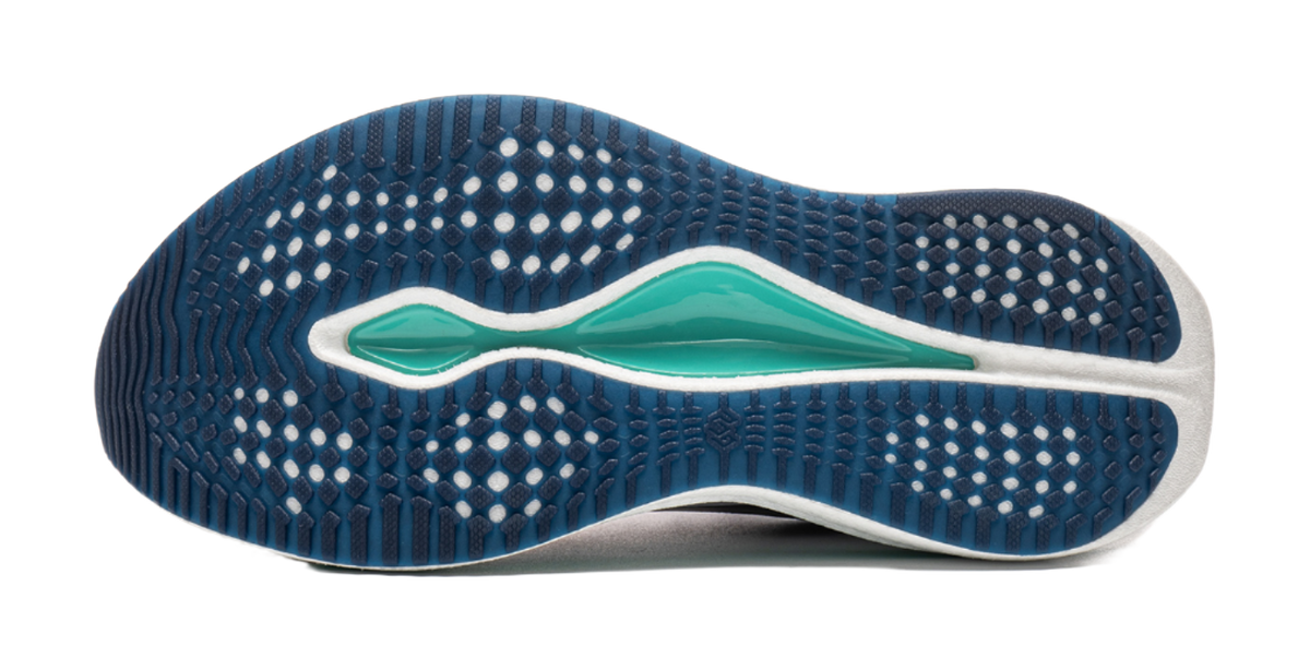 Underside of navy running shoe with teal accent and geometric tread pattern