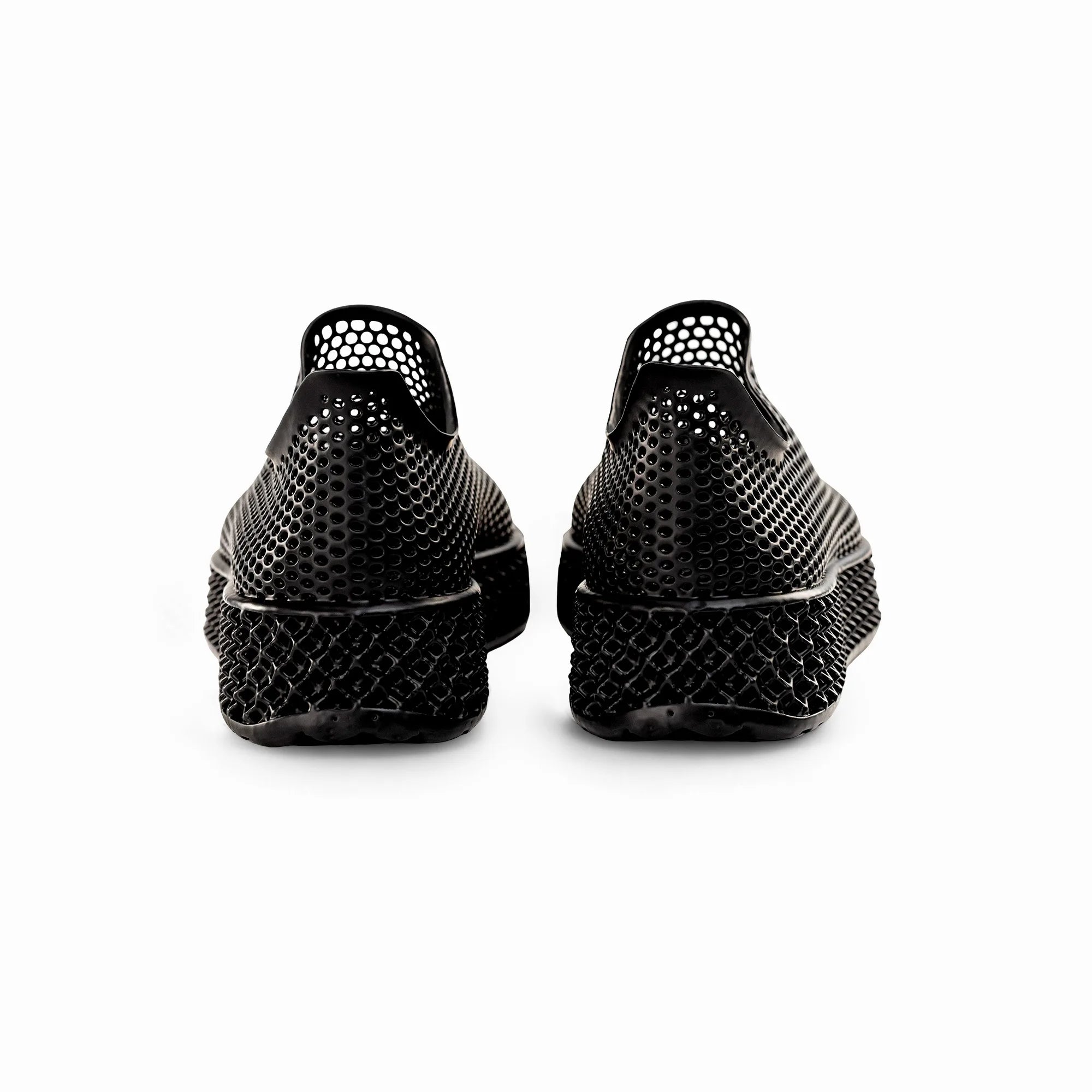 Black 3D-printed sneakers from the back view with perforated heel and cushioned sole