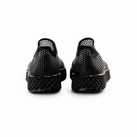 Black 3D-printed sneakers from the back view with perforated heel and cushioned sole