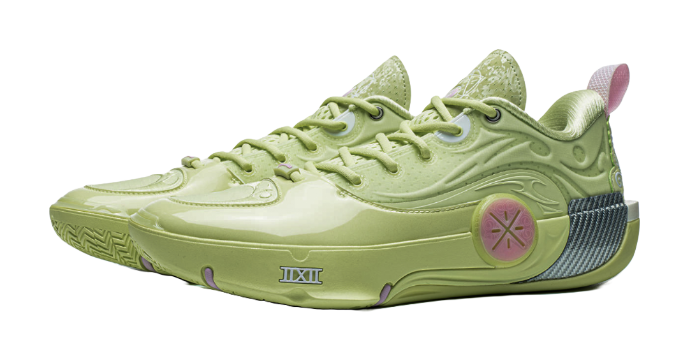 Green basketball shoe angled view with lace-up and pink circular emblem on side