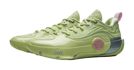 Green basketball shoe angled view with lace-up and pink circular emblem on side