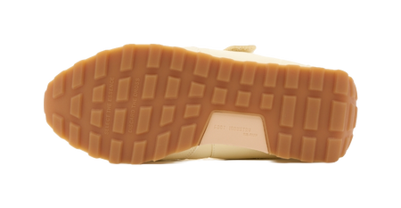 Light yellow Mary Jane shoe outsole with textured traction pattern