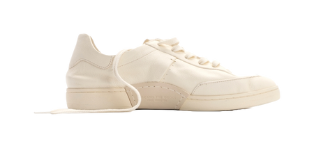 Unisex low-top lace-up trainers in antique white, angled front view