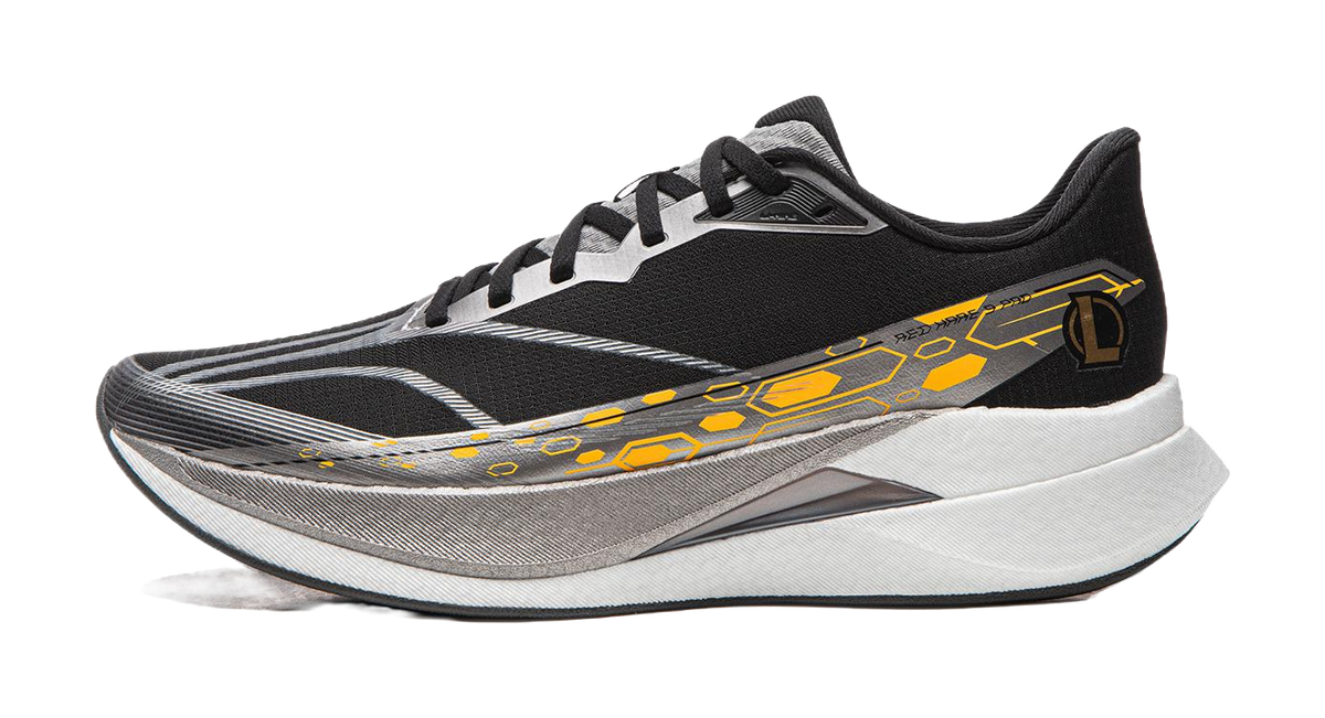 Black running shoe with white-gray sole and yellow-orange side graphic, lace-up.